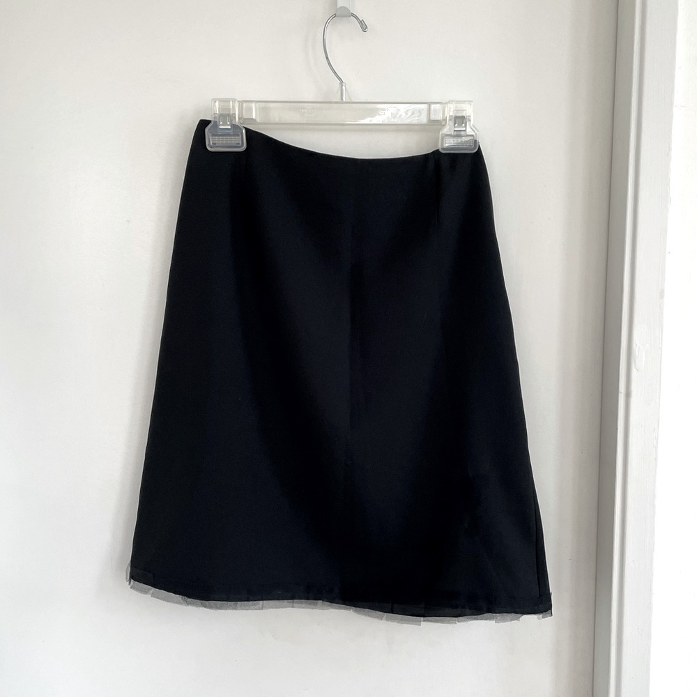 A line black skirt with subtle mesh lace at hem